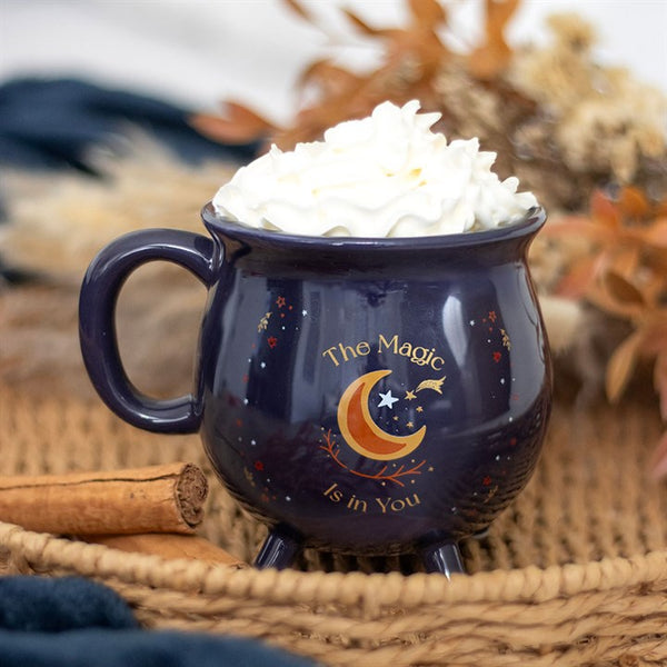 Blue cauldron-shaped ceramic mug with crescent moon, stars and ‘The Magic Is in You’ text – Panache Homeware Kitchen Collection, mystical cottagecore coffee cup.