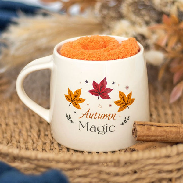 Autumn Magic white ceramic mug with colorful leaf design and orange socks – Panache Homeware Kitchen Collection, cozy autumn mug gift set, perfect gift.