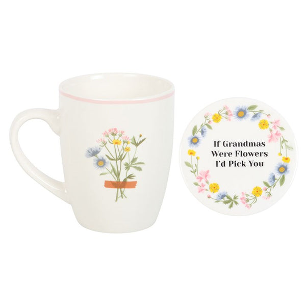 White mug with floral design and matching coaster on a white background