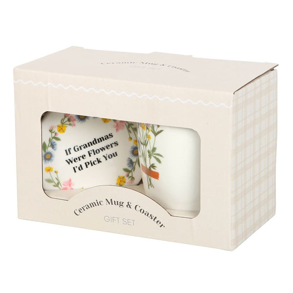 Ceramic mug and coaster set in packaging with floral design and text.