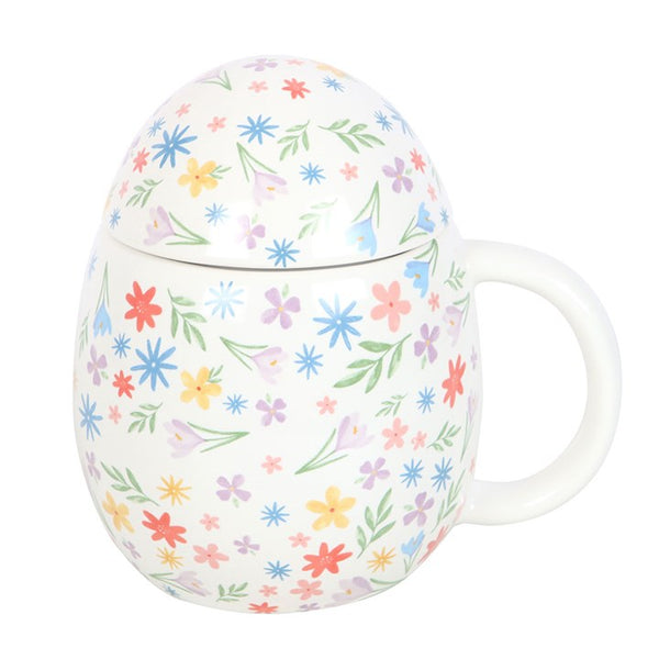 White mug with colorful floral pattern on a white background