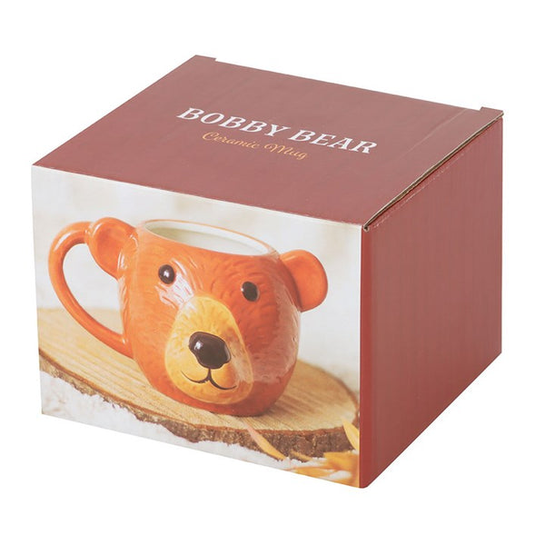 Box of a bear-shaped ceramic mug with a wooden base.