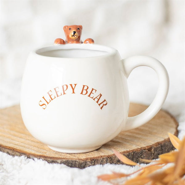 White rounded ceramic mug with ‘Sleepy Bear’ text and bear figurine – Panache Homeware Kitchen Collection, cozy woodland cottagecore coffee cup, perfect gift.