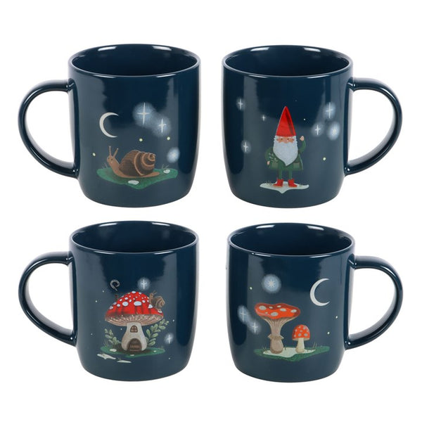 Set of four navy blue mugs with gnome, snail, and mushroom designs on a white background