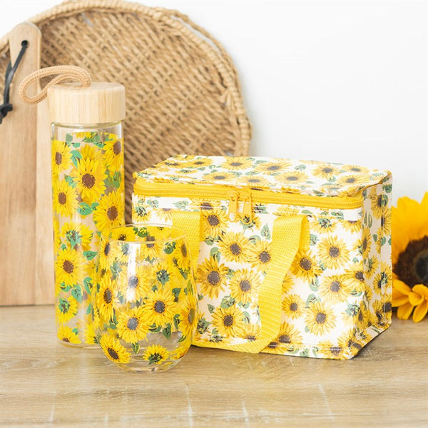 Sunflower-patterned lunch bag and water bottle on a wooden surface.