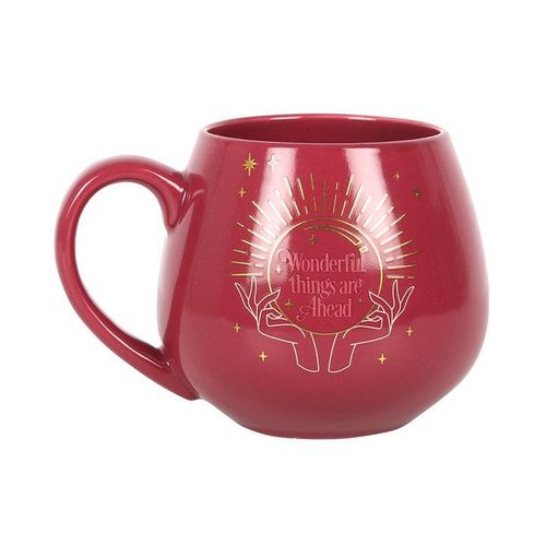 Red mug with gold illustrations and text on a white background